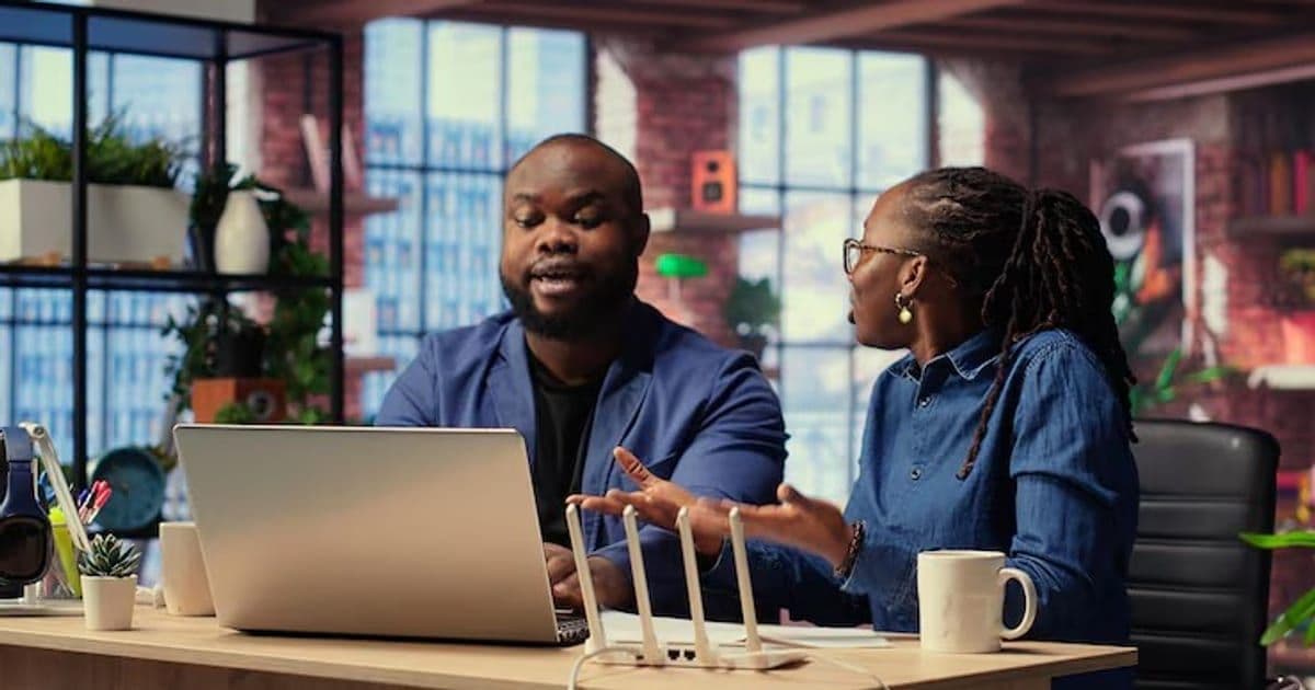 Angry African American people tries to reset the Wi Fi modem due to signal loss